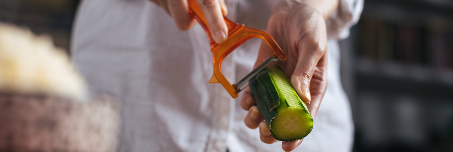 chef trimming cucumber