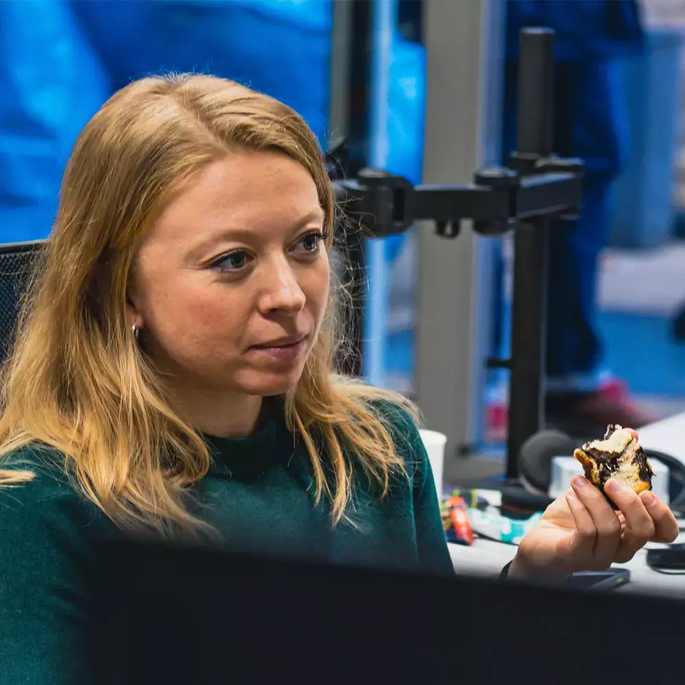 our people woman eating biscuit